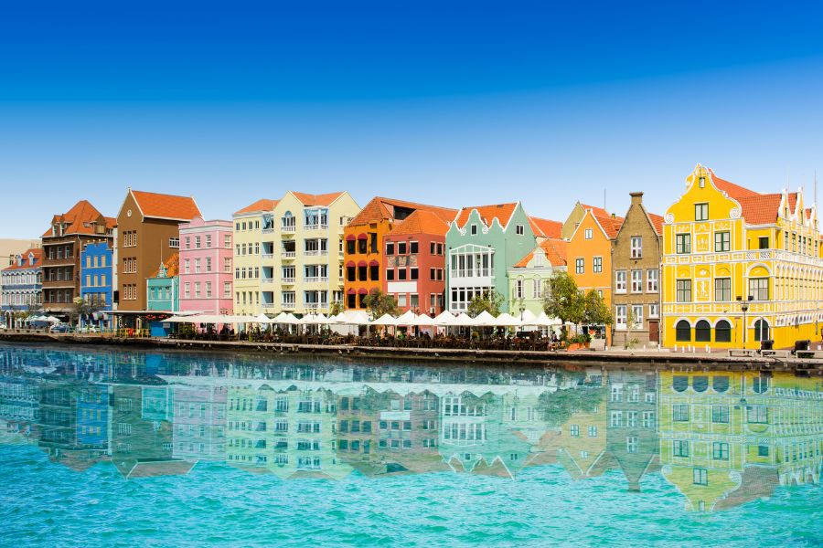 Image of Curacao with colourful buildings and clear ocean 