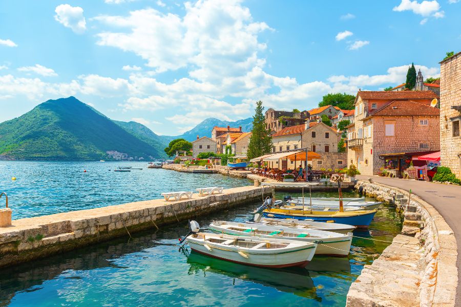 Image of Montenegro surrounded by oceans and small sailing boats 
